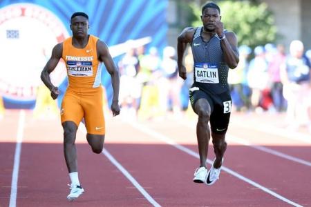Christian Coleman (left) and Justin Gatlin (right) compete during the men's 100m semifinals