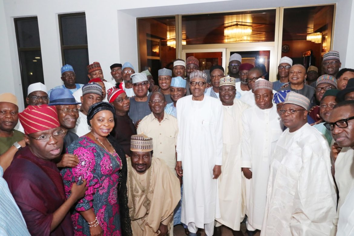 Muhammadu Buhari (M) with APC National Chairman, Comrade Adams Oshiomhole (4th L) and the members of APC Senators after their meeting at the Presidential Villa in Abuja on Wednesday night